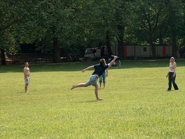 Some guys playing frisbee in Hyde Park