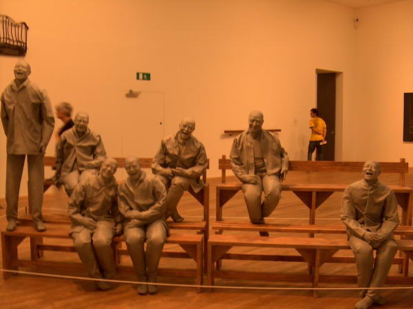 Plaster guys on benches, if you stand in the corner they look like laughing at you;-)
