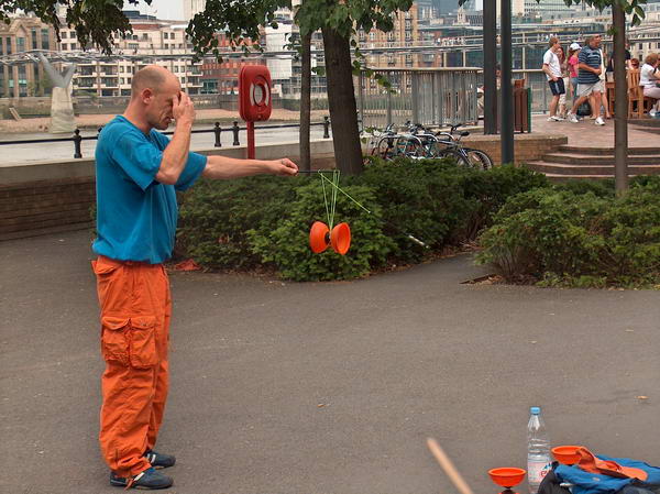Street performer on the bank