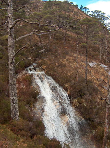 The hike leads around a waterfall