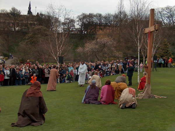 Followers pray at the cross