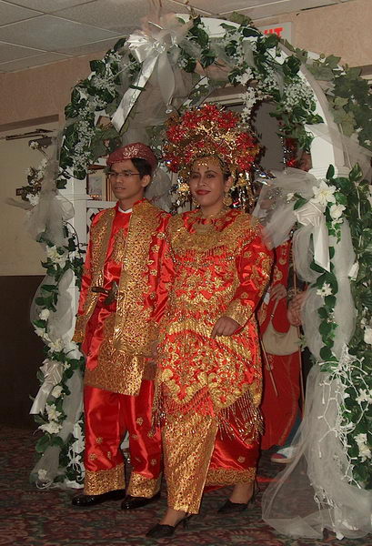 And here comes the couple in traditional Minangkabau (Indonesian tribe living in West Sumatra) wedding attire