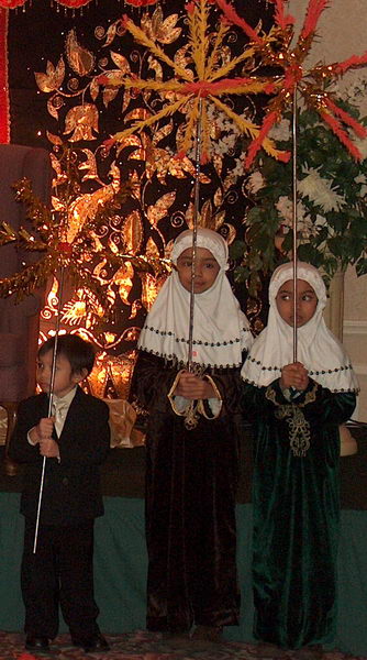 Everybody is included: children carry decorations