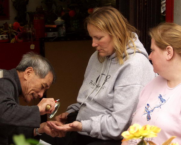 Fortune-teller with magnifying glass