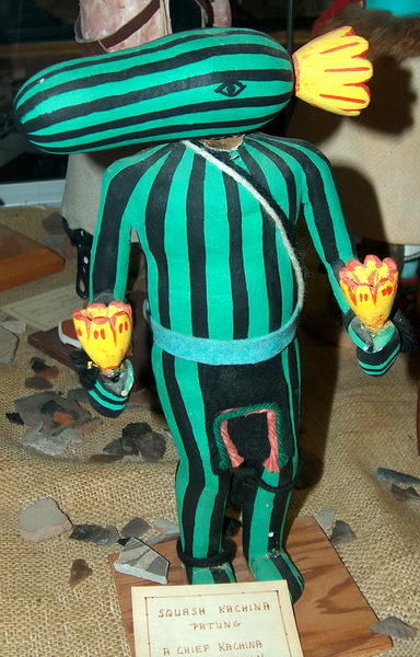 Cucumber guy: Squash Kachina (it's a ritual doll of the Hopi people)