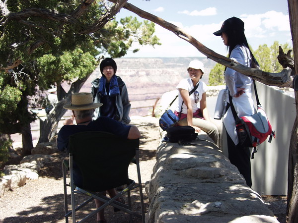 Three chicks chatting with an old Canyon veteran